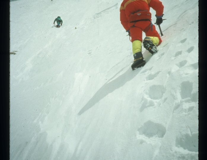 Author and Greg Mortimer climbing onto summit ridge on K2